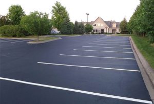 Parking Lot After Patching, Sealing, and Striping (commercial parking lot asphalt sealcoating repair)